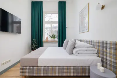 a bedroom with a bed and a couch at Studio for 2 - Augustiańska 1 - Kazimierz in Kraków