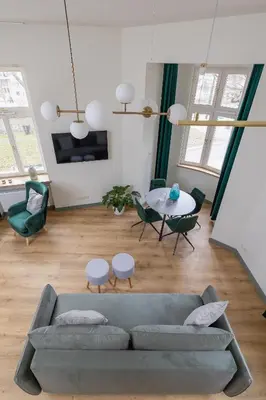 a living room with a couch and a table at Cozy apartment - Augustiańska 1 street in Kraków