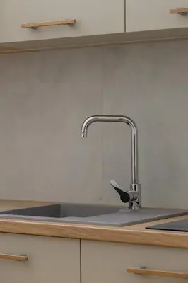 a kitchen sink with a faucet on a counter at Apartment for 6 people - Augustiańska 1 in Kraków