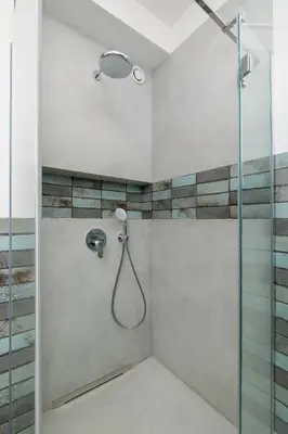 a bathroom with a shower with a glass door at Apartment for 6 people - Augustiańska 1 in Kraków