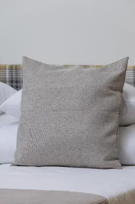a pillow sitting on top of a bed at Apartment for 6 people - Augustiańska 1 in Kraków