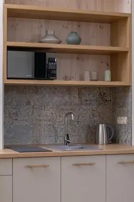 a kitchen with a sink and a microwave at Apartment for 6 - Augustiańska 1 street in Kraków