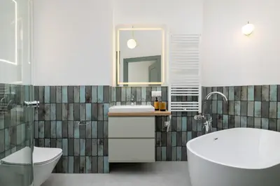 a bathroom with a sink and a toilet and a tub at Apartment for 6 - Augustiańska 1 street in Kraków