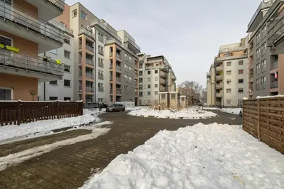 a pile of snow on a street with buildings at Klimatyzowany Apartament z Balkonem i Przestrzenią do Pracy Lokalizacja Blisko Wisły by Noclegi Renters in Kraków