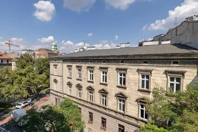 a large brick building on a city street at 2 Bedroom apartment with AC - Augustiańska 1 in Kraków