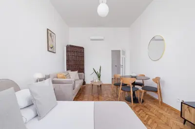 a living room with a couch and a table at 2 Bedroom apartment with AC - Augustiańska 1 in Kraków