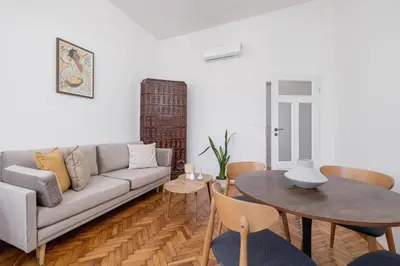 a living room with a couch and a table at 2 Bedroom apartment with AC - Augustiańska 1 in Kraków