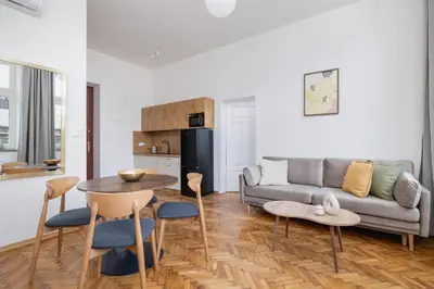 a living room with a couch and a table at Kazimierz Area - Augustiańska 1 street in Kraków