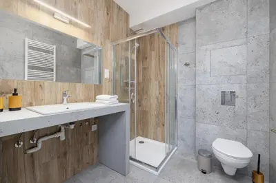 a bathroom with a sink and a toilet and a shower at Jewish Quarter - Augustiańska 1 street in Kraków