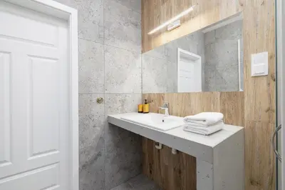 a bathroom with a sink and a mirror at Jewish Quarter - Augustiańska 1 street in Kraków