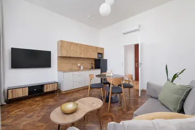 a living room with a couch and a table at 1 bedroom Apartment - Augustiańska 1 street in Kraków