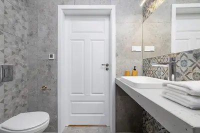 a bathroom with a toilet and a sink at Apartment with the balcony - Augustiańska 1 in Kraków
