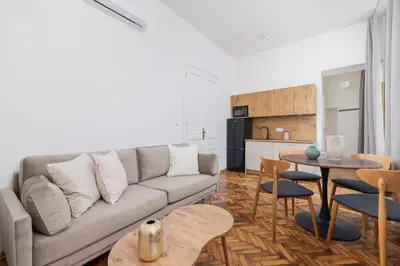 a living room with a couch and a table at Apartment with the balcony - Augustiańska 1 in Kraków