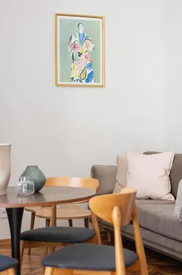 a living room with a table and a couch at Apartment with the balcony - Augustiańska 1 in Kraków