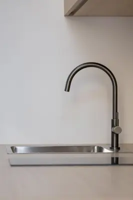 a stainless steel sink in a kitchen at Cozy studio - Augustiańska 1 in Kraków