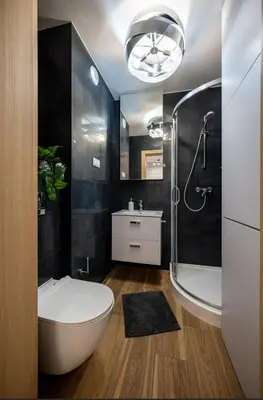 a bathroom with a toilet and a sink and a shower at Verona ElevenFive in Kraków