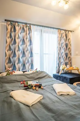 a bed with two towels on top of it at Kraków Studio - Vistula River nearby - by Rentujemy in Kraków