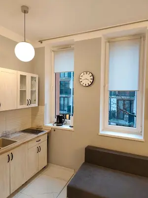 a small bathroom with a shower and a toilet at Daniel Apart Hotel Krakow Comfort in Kraków