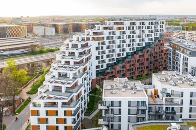 a balcony with a table and a view of the city at Apartamenty Lew Invest obok Rynku Głównego 279, Parking w cenie in Kraków