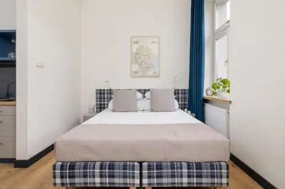 a bedroom with a bed in a room at Jewish Quarter- Augustiańska 1- AC in Kraków