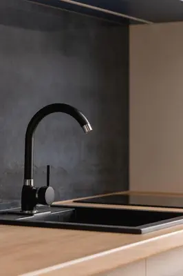 a kitchen sink with a faucet on a counter at Jewish Quarter- Augustiańska 1- AC in Kraków