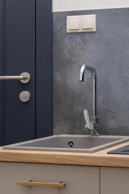 a kitchen sink with a faucet on a counter at Apartment- AC - Augustiańska 1- Jewish Quarter in Kraków
