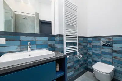 a bathroom with a sink and a toilet at Apartment - Augustiańska 1 - Studio for 2 in Kraków