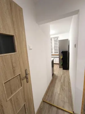 a small kitchen with a sink and a microwave at A cozy corner of Płaszów in Kraków
