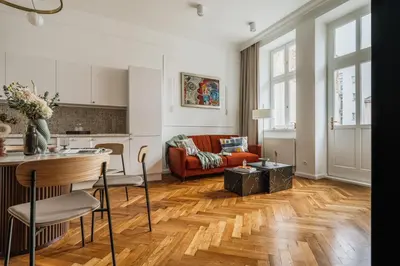 a hallway with a door and a suitcase on the floor at Pinata Apartment - Orzeszkowej 8 in Kraków