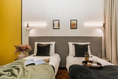 a kitchen and dining room with a table and chairs at Pinata Apartment - Orzeszkowej 8 in Kraków