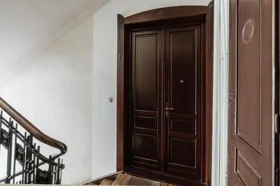 a bedroom with a large bed and yellow walls at Pinata Apartment - Orzeszkowej 8 in Kraków