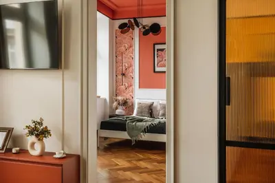 a bedroom with a bed with a dinosaur blanket on it at Pinata Apartment - Orzeszkowej 8 in Kraków