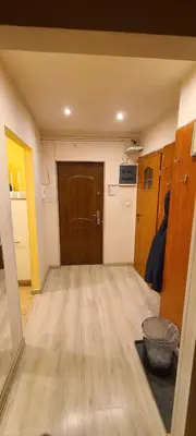 an empty room with a door and a wooden floor at Centrally located cozy apartment in Kraków