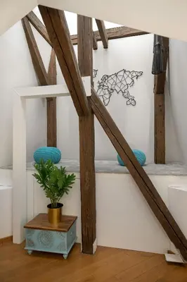 a staircase in a room with wooden beams at Modern Apartment with Air Conditioning and Terrace near Old Town in Cracow by Noclegi Renters in Kraków