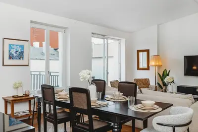a living room with a table and chairs at Antique Apartments - Tomasza 6A in Kraków