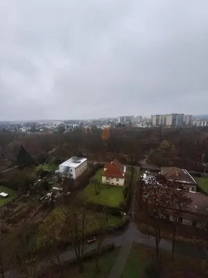 an aerial view of a town with buildings and trees at Sky View Cracow Apartment in Kraków