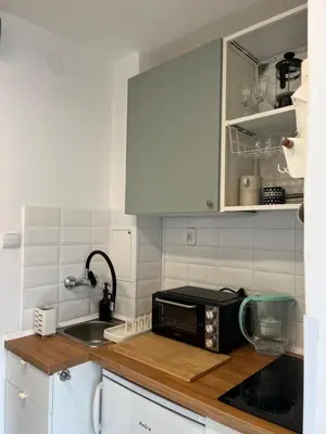 a kitchen with a counter top with a microwave at Studio Krowodrza Centrum in Kraków