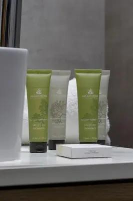 a group of three products sitting on a shelf at Cozy Apartment with Balcony in Cracow by Noclegi Renters in Kraków