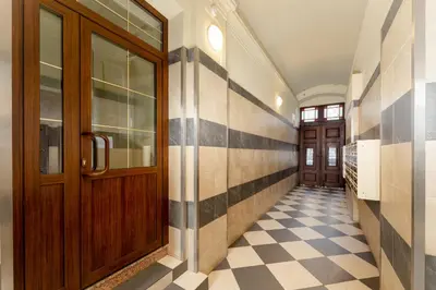 a bathroom with a shower and a washing machine at Cracow City Centre Apartment by BookingHost in Kraków