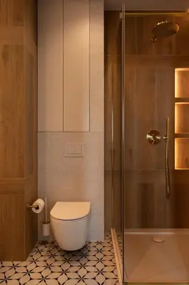 a bathroom with a toilet and a shower at SOFTly Landmark View City Center FREE PARKING in Kraków