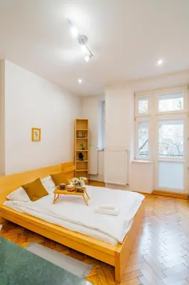 a large white bedroom with a large bed in a room at Piasek Studio - Old Town nearby - by Rentujemy in Kraków