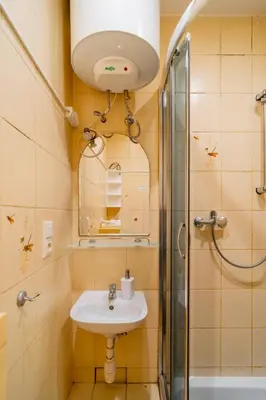a bathroom with a sink and a shower at Piasek Studio - Old Town nearby - by Rentujemy in Kraków