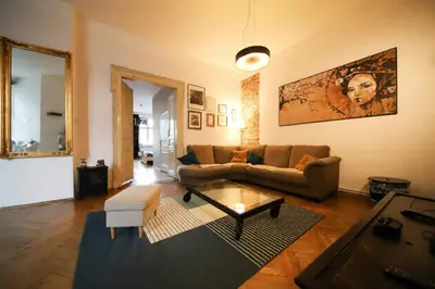 a living room with a couch and a table at Urban Nest Apartments Radziwiłłowska 17 in Kraków