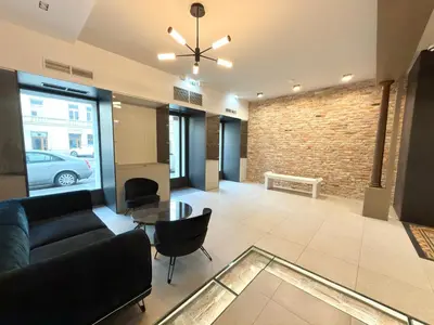 a living room with a couch and a table at Wawel Riverside Apartment free Parking in Kraków