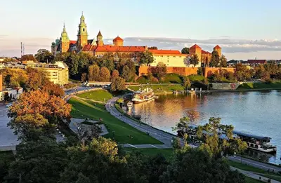 a view of a city with a river and buildings at Wawel Riverside Apartment free Parking in Kraków
