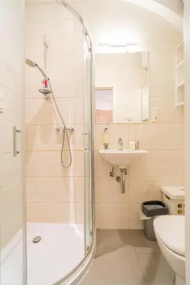 a bathroom with a shower and a sink at Krakow Old Town Studio N1 - by Rentujemy in Kraków