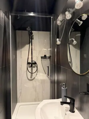 a bathroom with a toilet and a sink and a shower at Lanzo ST 48 in Kraków
