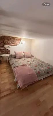 a bedroom with a bed and a table in it at Old town Krakow in Kraków