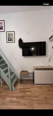 a living room with a tv on a wall at Old town Krakow in Kraków