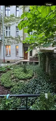 a building with a lot of leaves on the ground at Old town Krakow in Kraków